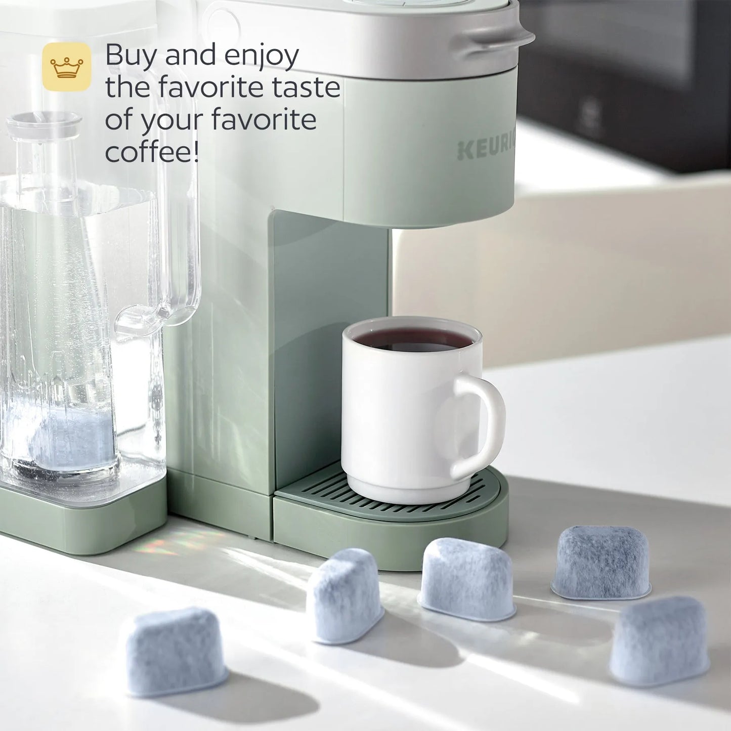 Keurig coffee maker with a white mug filled with coffee on a light surface.