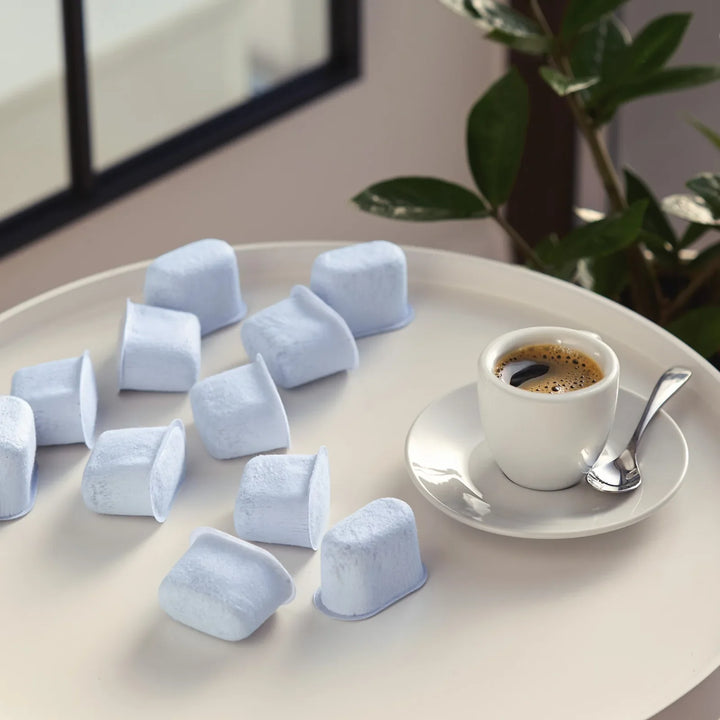 Replacement charcoal water filters for Breville espresso machines beside a cup of espresso