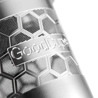 Close-up of a steel reusable K-Cup with 'GoodCups' branding and honeycomb pattern.