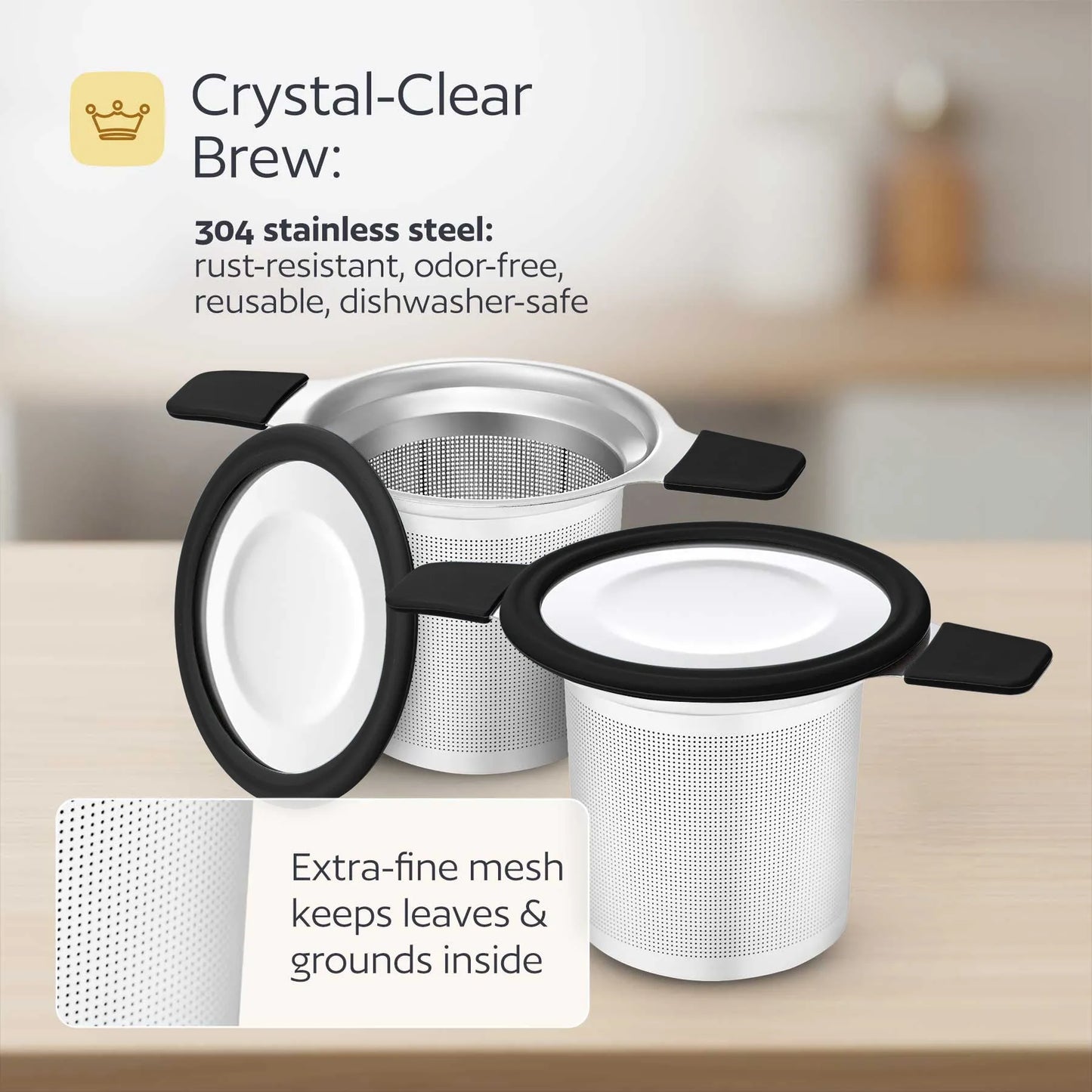 Stainless steel tea infuser with text highlighting features on a blurred kitchen background