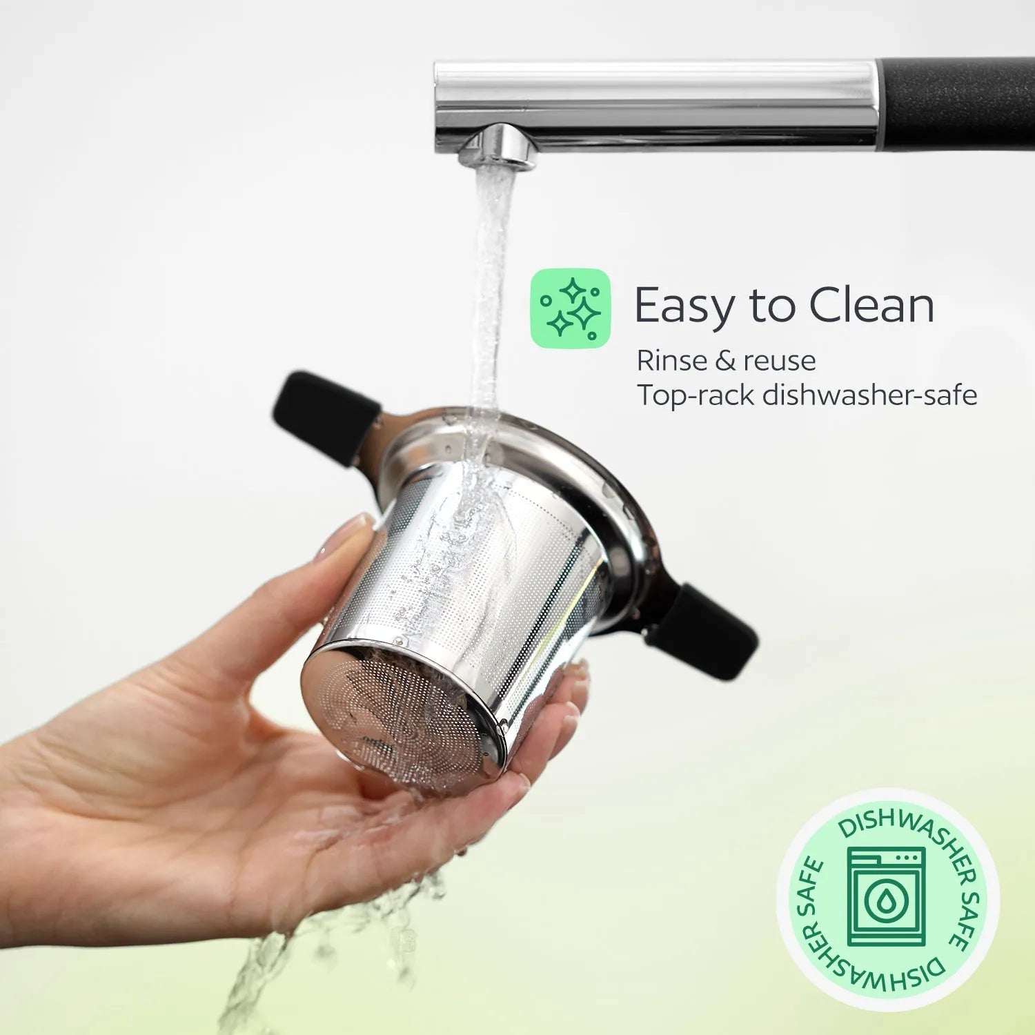 Hand holding a Stainless Steel Tea Infuser under running water with text indicating it is easy to clean and dishwasher-safe.