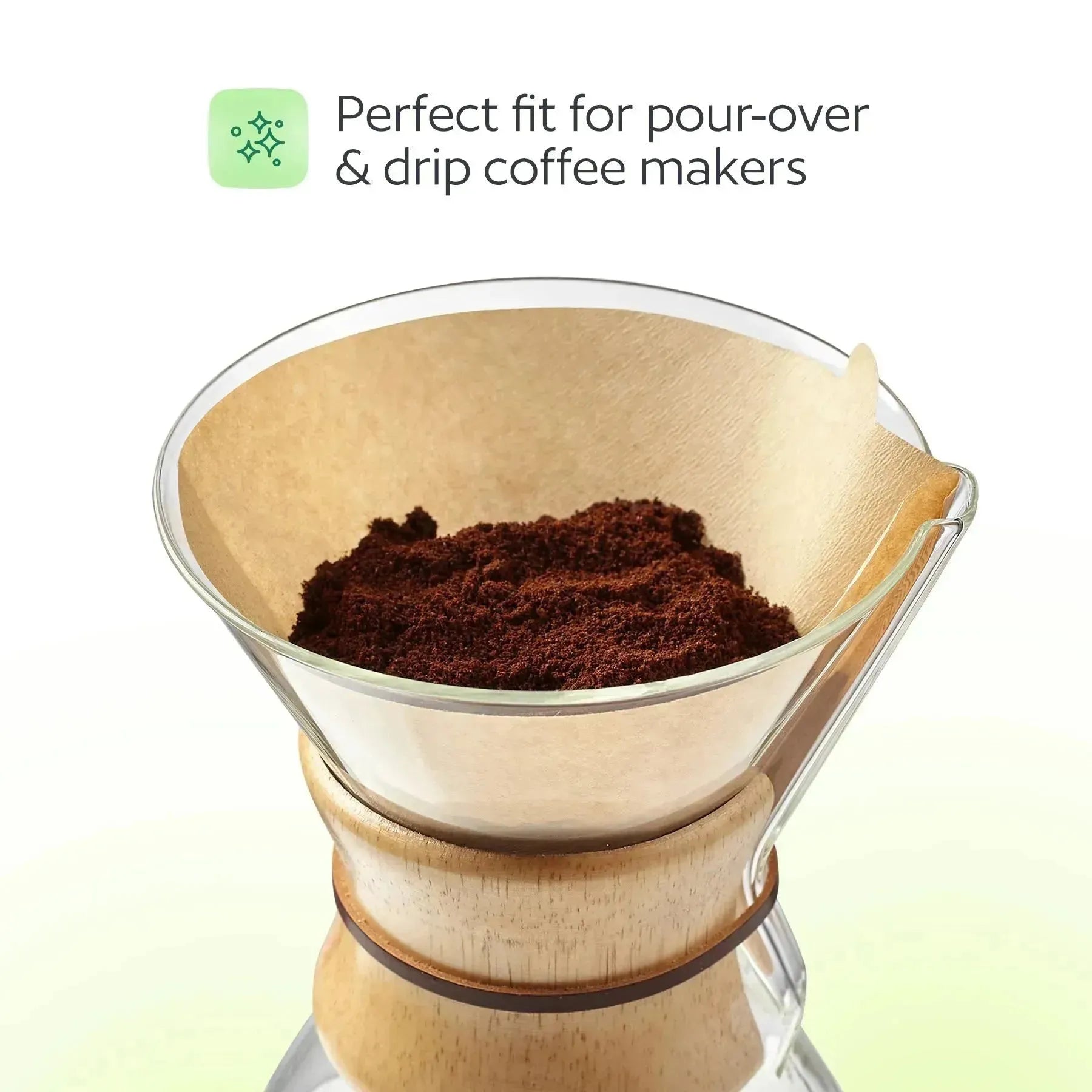 Wooden coffee filter with ground coffee inside on a white background