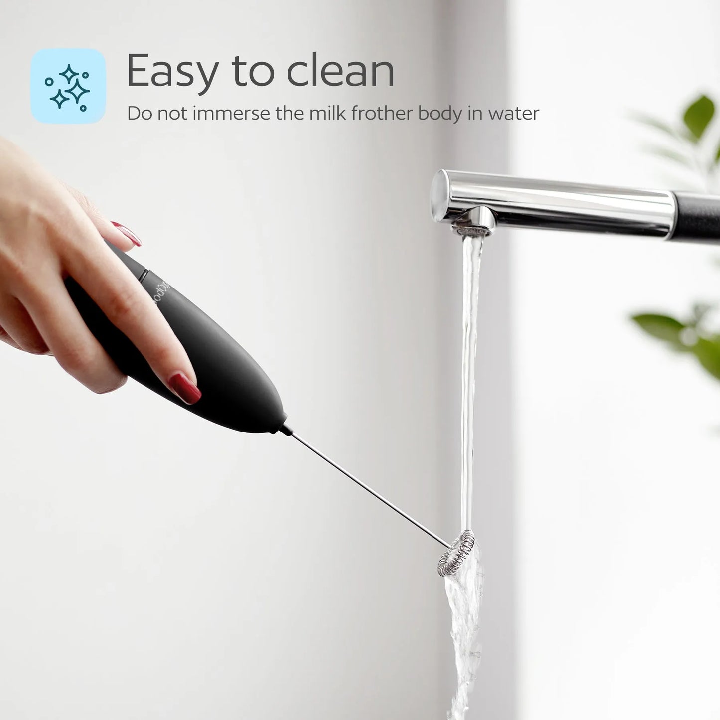 Hand using a milk frother with text 'Easy to clean' 